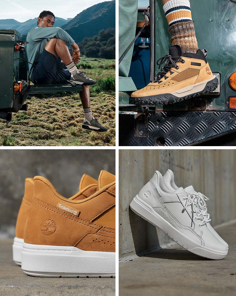 Image of white Timberland sneakers on concrete. Image of wheat Timberland sneakers with white outsoles on concrete. Image of wheat Timberland hiking boots with black outsoles stepping up into a green pickup truck on the running board. Image of a man sitting on a truck tailgate out in a green valley, leg dangling, wearing olive green Timberland hiking shoes with black and white outsoles, navy shorts and a light blue long sleeved shirt.